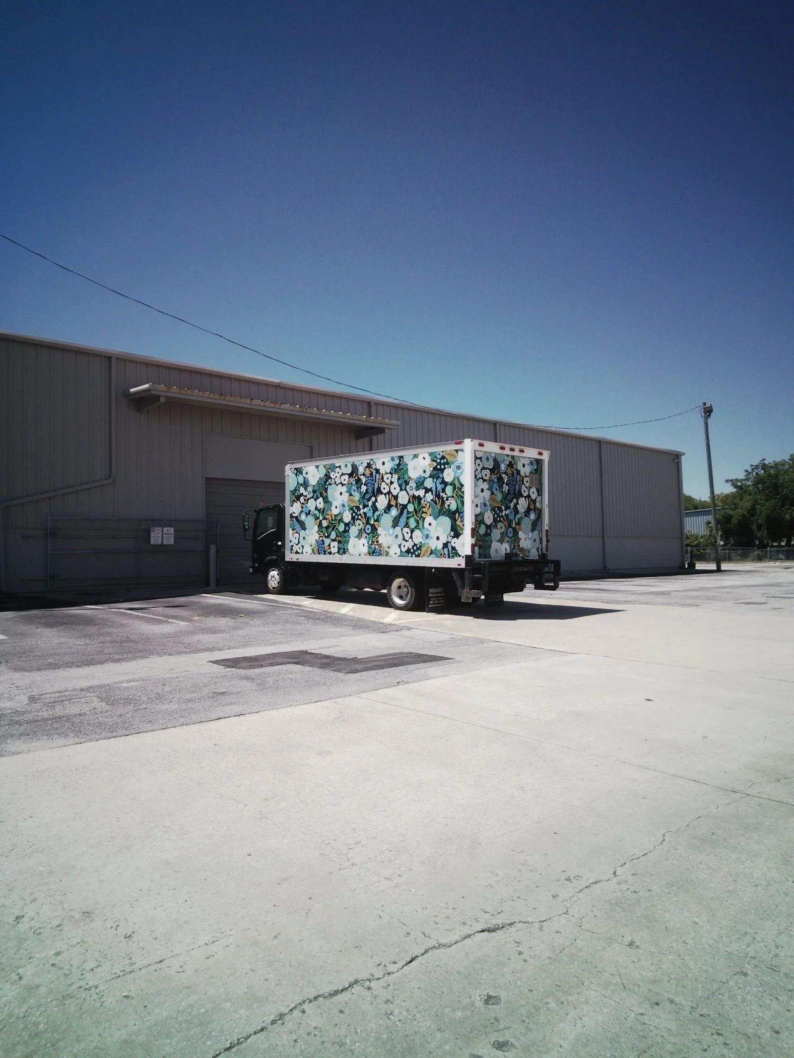 Box truck parked outside a US warehouse