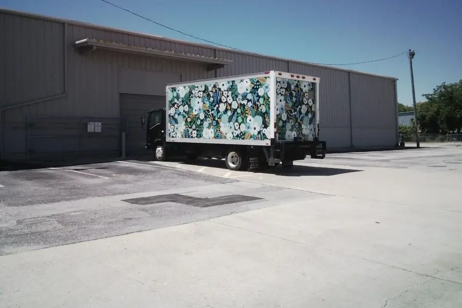 Box truck parked outside a US warehouse