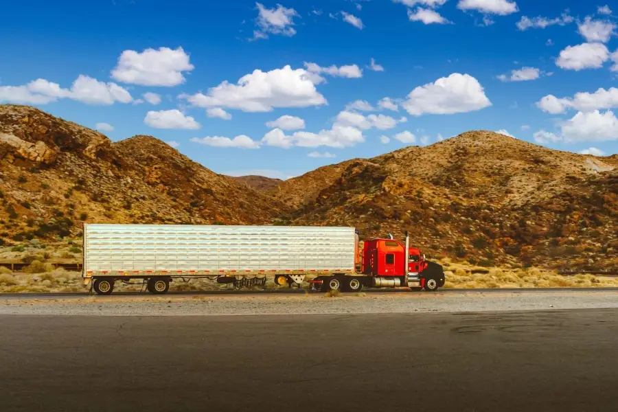 Refrigerated trailer truck on a desert highway